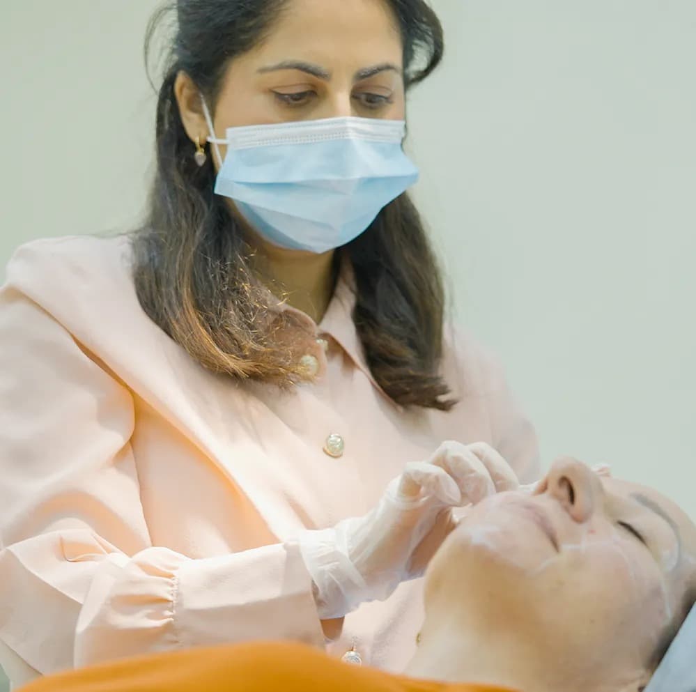 Doctor administering joint injection at The One Clinic
